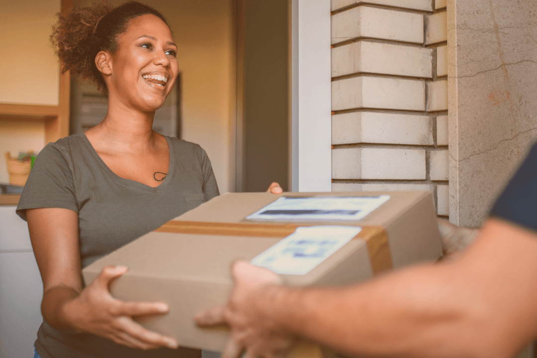 ecommerce retail delivery, smiling person receiving a delivery