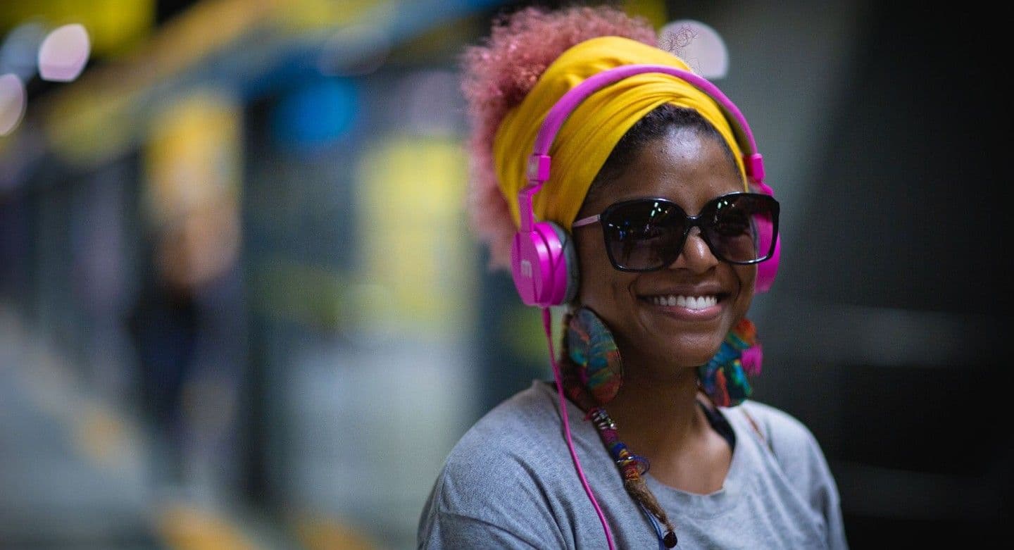 woman listening to music on subway