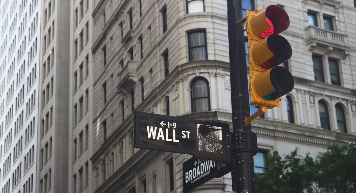 traffic light post with Wall Street on the sign