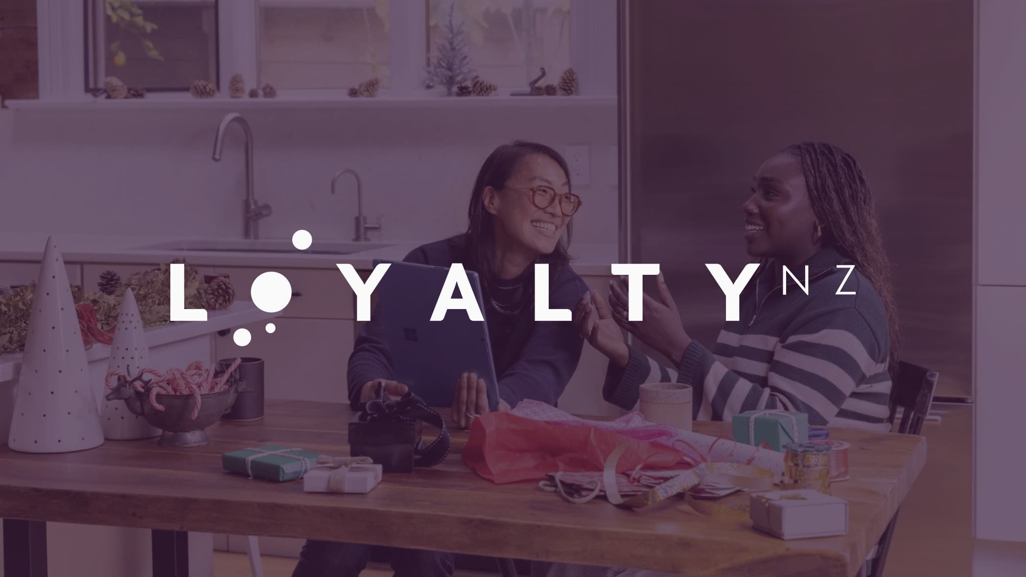 Loyalty NZ logo over background of people talking